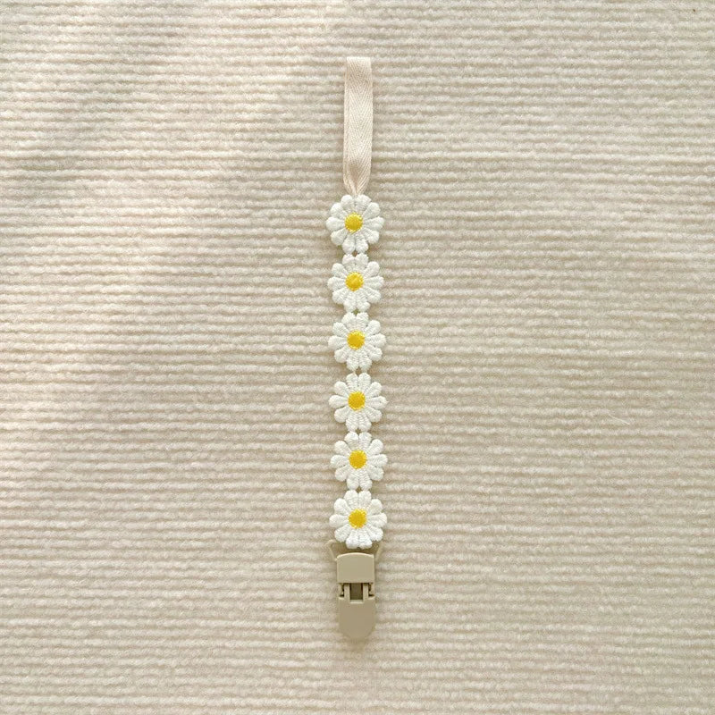 Attache tétine florale