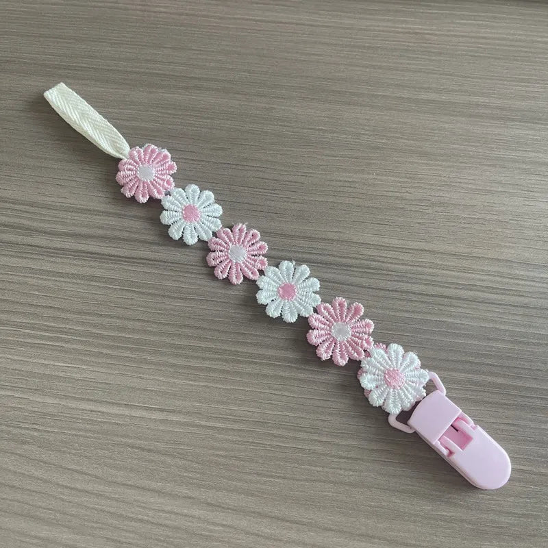 Attache tétine florale